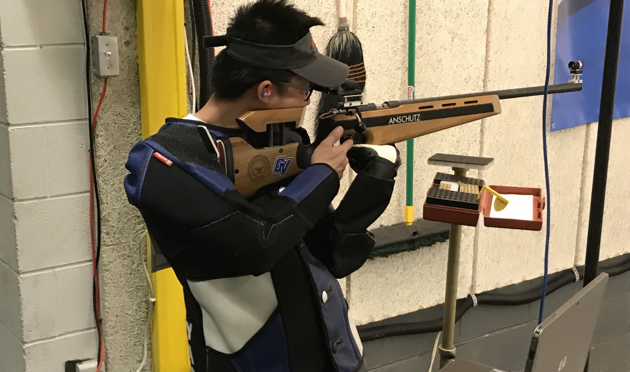 Rifle athlete, Christian Yap, prepares for competition shot during virtual competition.